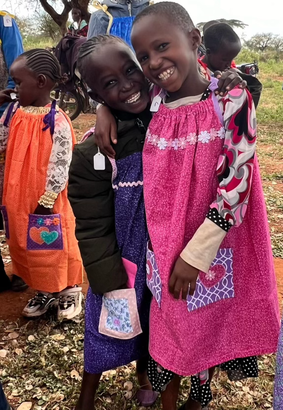 2 girls wearing dresses in Uganda