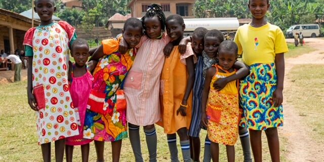 girls wearing colorful dresses