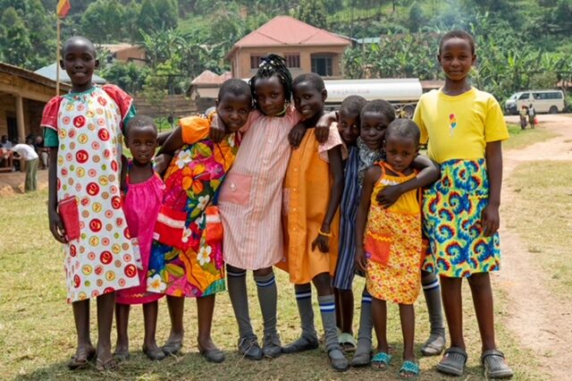 girls wearing colorful dresses