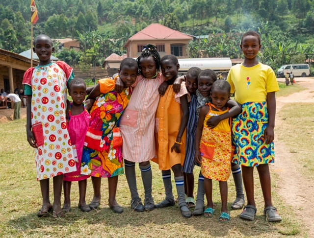 girls wearing colorful dresses