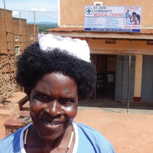 Teo in front of her clinic