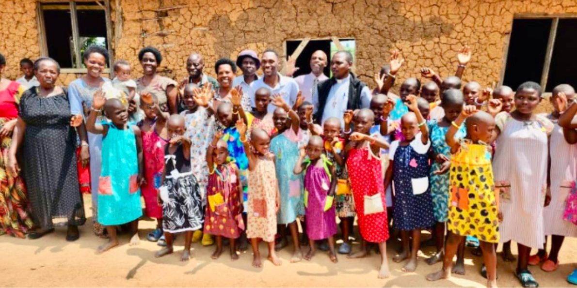 IMG_3883 A large group of young girls wearing dresses made by St.Mary's and the MAAP Foundation in Uganda.