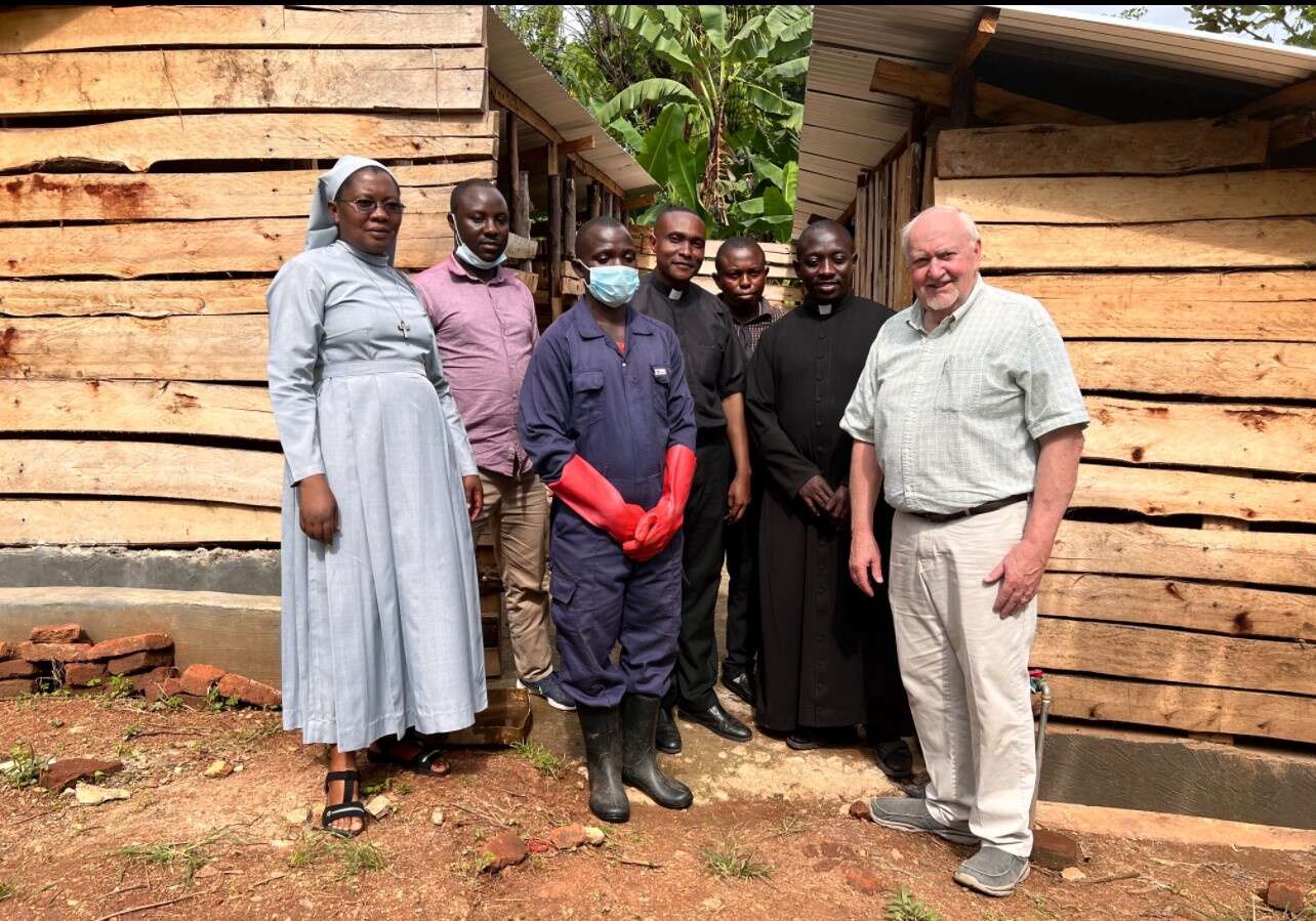 The African staff at a pig farm